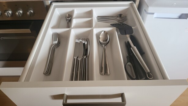 A kitchen drawer with utensils neatly organized. - Stunning 1-Bed Apartment in Bodolz Lake Constance (Bodolz)