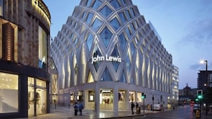 A modern building with a distinctive geometric facade and the name "John Lewis" prominently displayed. - 2 Bed House - Sleeps 4 - Parking - Wifi (Leeds)