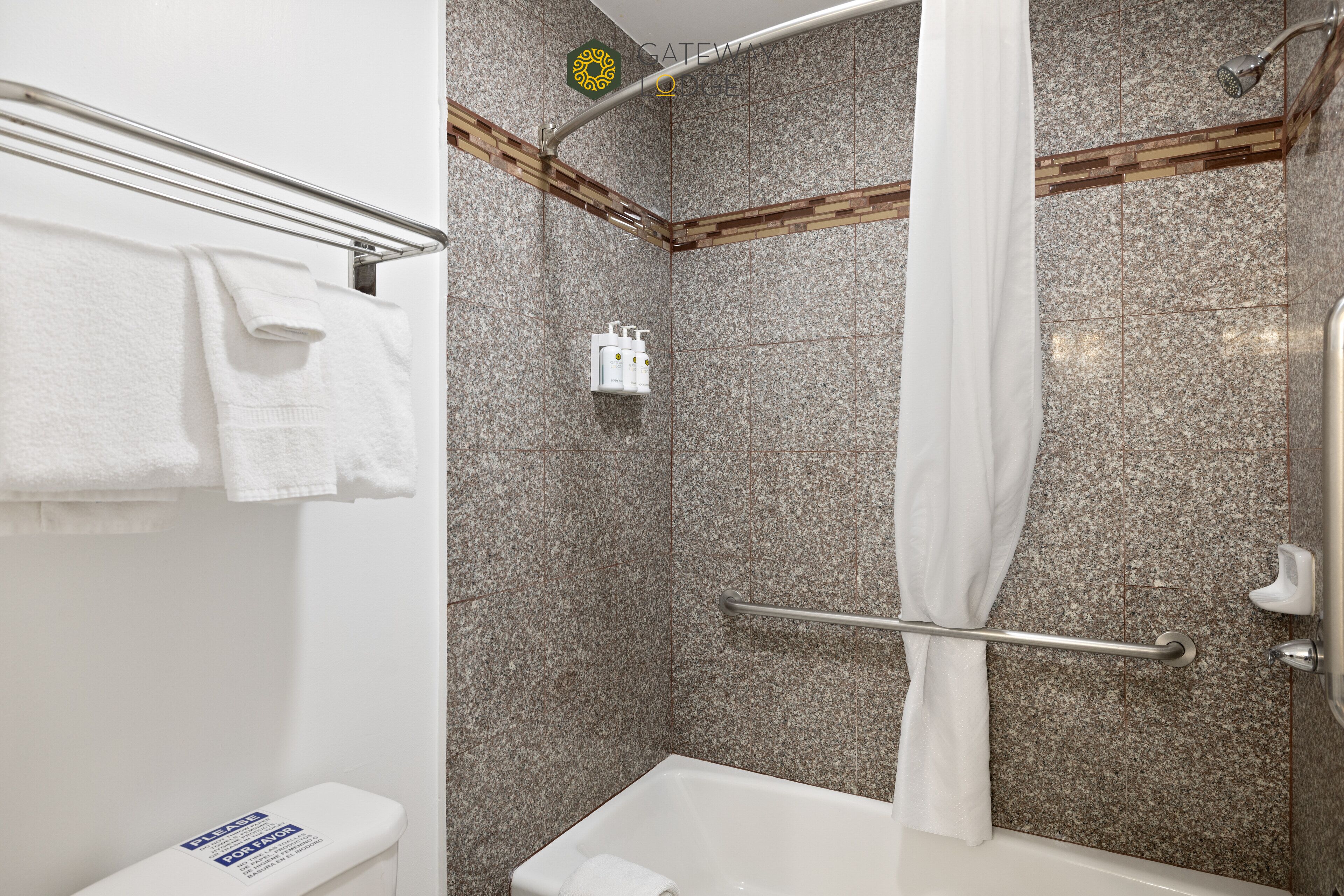 A bathroom with a shower, a bathtub, and a toilet.