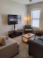 City Apartment | Living area | 50-inch Smart TV with digital channels, TV, streaming services