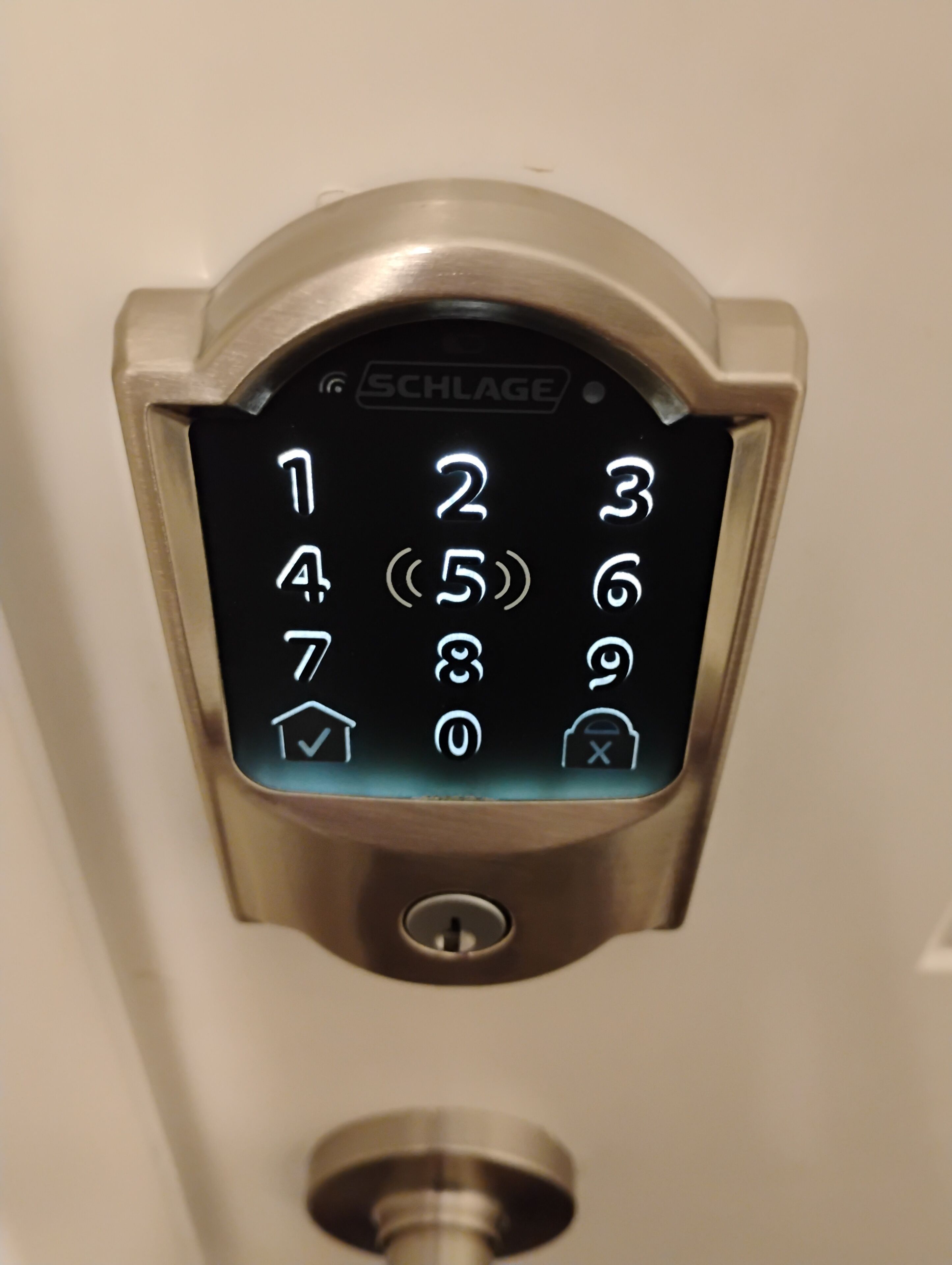 A Schlage electronic keypad lock on a door.