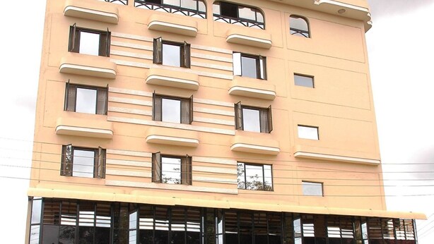 A hotel named "CICADA" with a modern architectural design, featuring multiple floors and large windows. - Cicada Hotel (Eldoret)