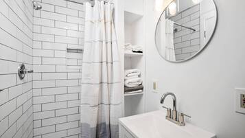 Shower, hair dryer, towels