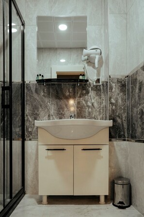 Hair dryer, slippers, towels, soap