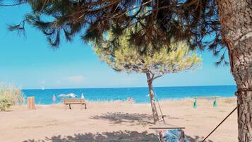 On the beach, sun loungers