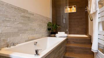 Bathtub, hair dryer, towels, soap