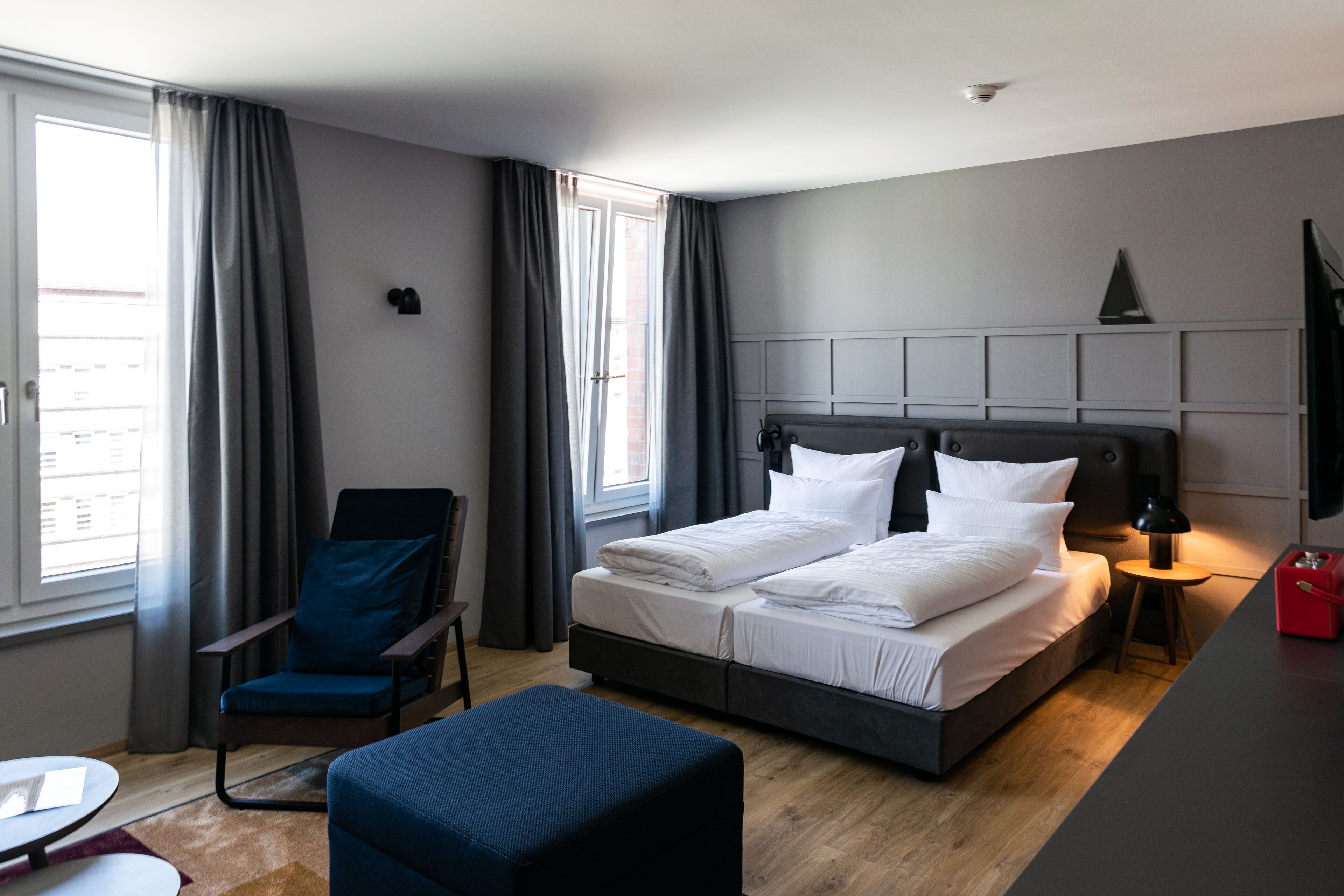 premium bedding, laptop workspace, soundproofing, travel cot