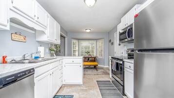 Microwave, dishwasher, coffee/tea maker, cookware/dishes/utensils