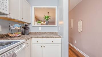 Microwave, dishwasher, coffee/tea maker, cookware/dishes/utensils