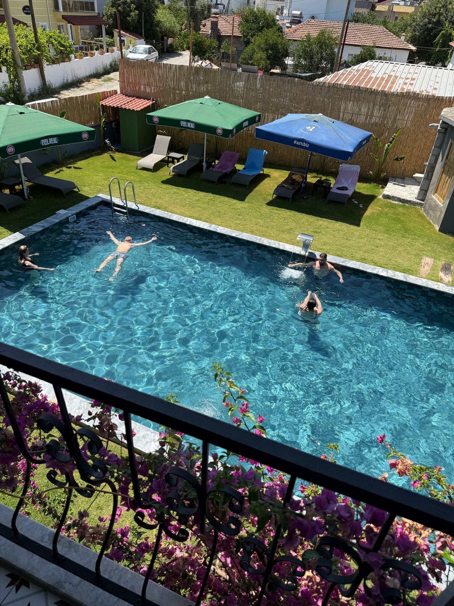 seasonal outdoor pool, pool umbrellas, pool loungers
