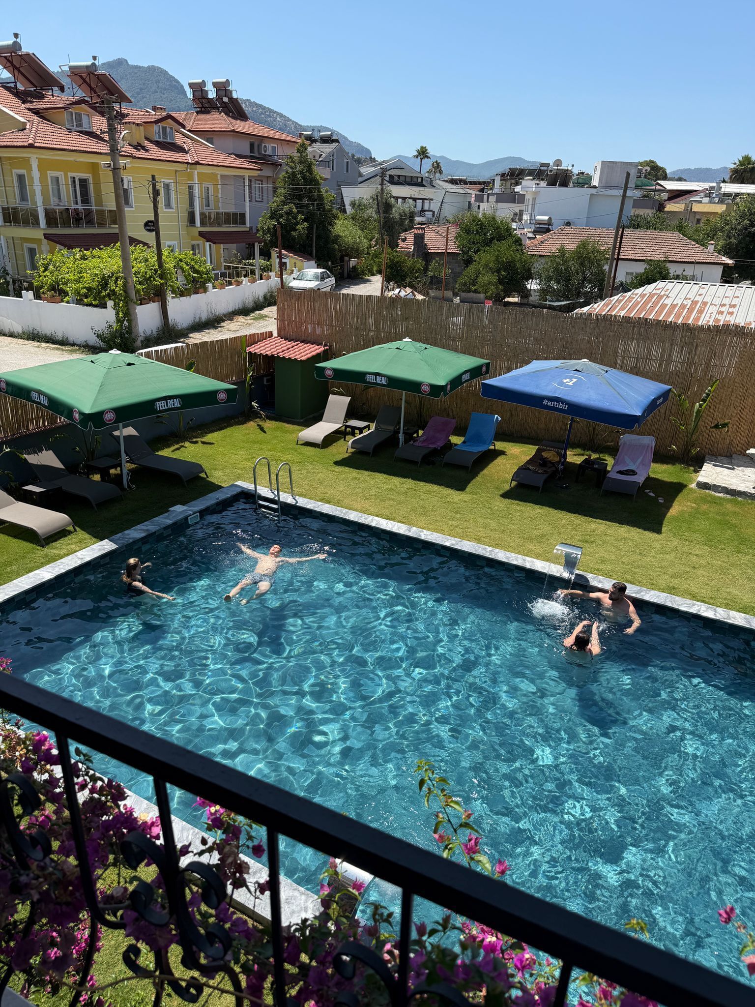 seasonal outdoor pool, pool umbrellas, pool loungers