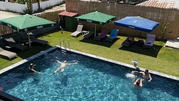 Seasonal outdoor pool, pool umbrellas, pool loungers