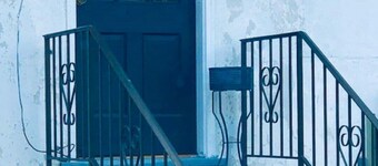The Blue Door steps from Handley Library