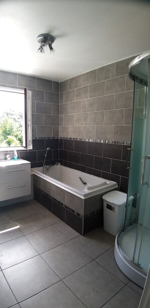 Bathtub, hair dryer, towels, soap