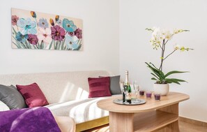 Family House, 2 Bedrooms, Terrace | Living area | 80-cm TV with satellite channels