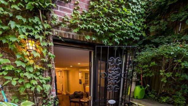 A brick building with a door leading to an interior space. - One Such Boston Gem w Pvt Garden (Boston)