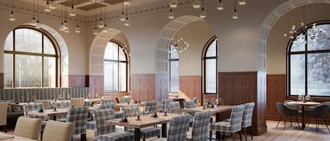 A restaurant with high arched windows, wooden paneling, and modern pendant lighting.