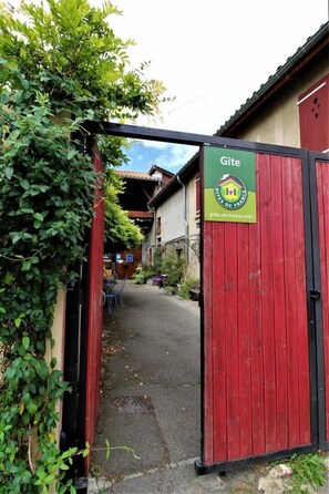 Enter a charming Gîte through this rustic gate, part of the Gîtes de France network.