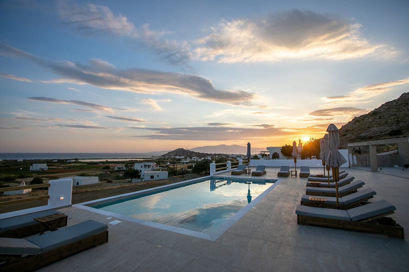 Seasonal outdoor pool, open 8:00 AM to 9:00 PM, pool umbrellas