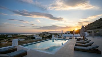 Seasonal outdoor pool, open 8:00 AM to 9:00 PM, pool umbrellas