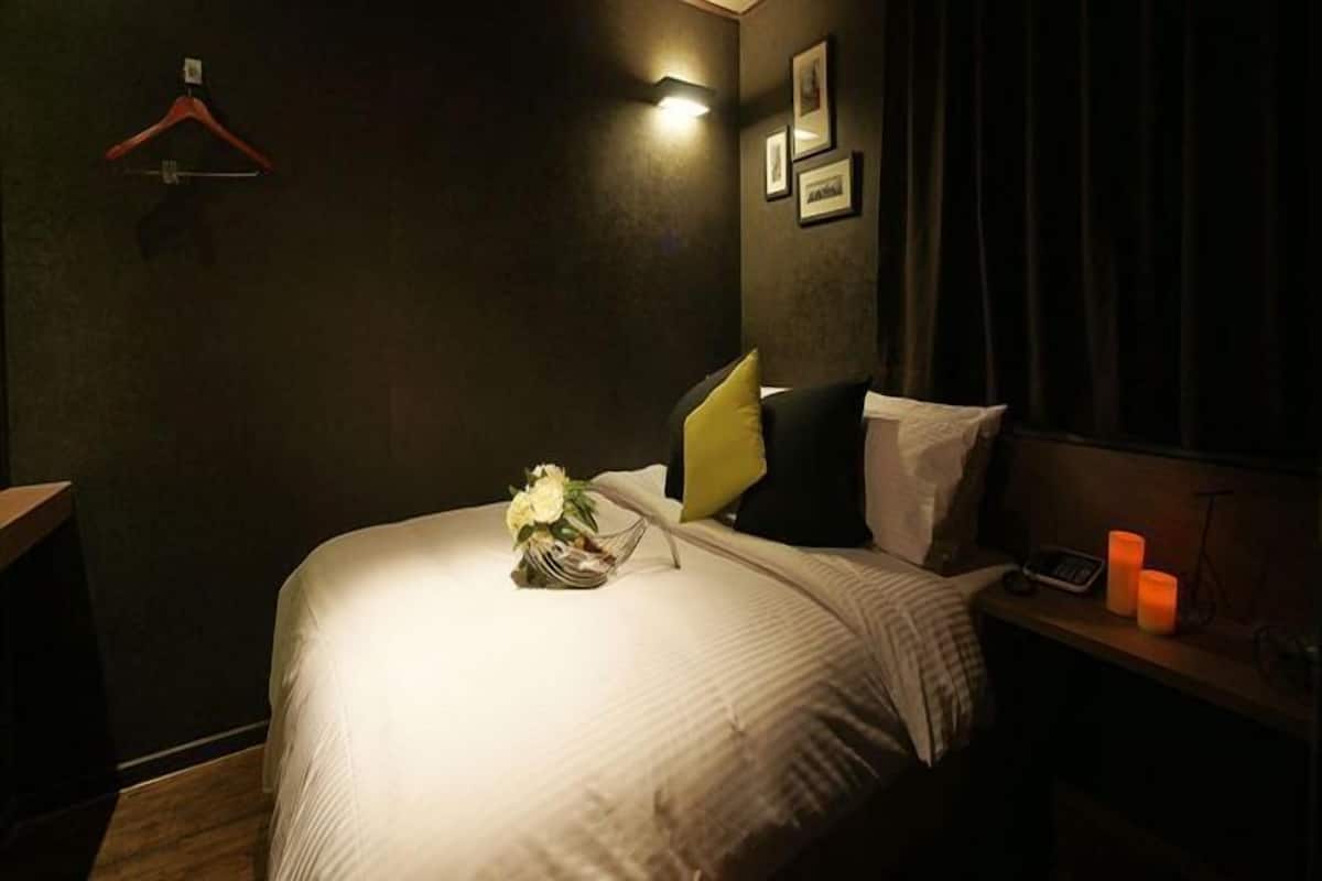 Premium bedding, memory foam beds, blackout drapes, free WiFi