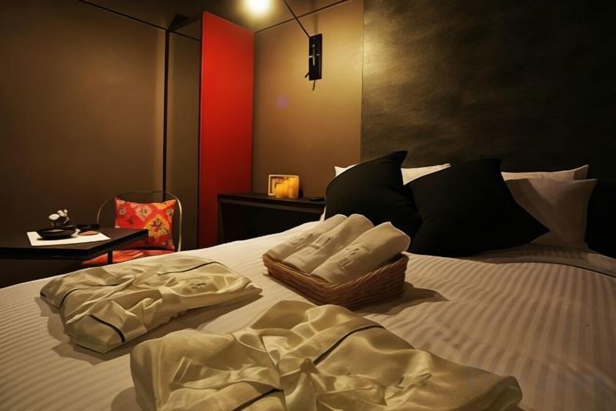 Premium bedding, memory-foam beds, blackout curtains, free WiFi