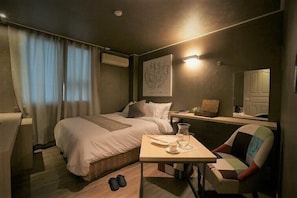 Habitación doble Deluxe | Ropa de cama de alta calidad y camas con efecto memoria