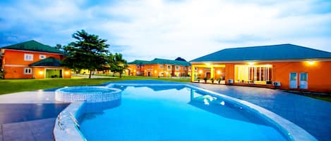 Indoor pool, outdoor pool, pool umbrellas, lifeguards on site
