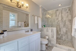 Combined shower/tub, hair dryer, towels, soap