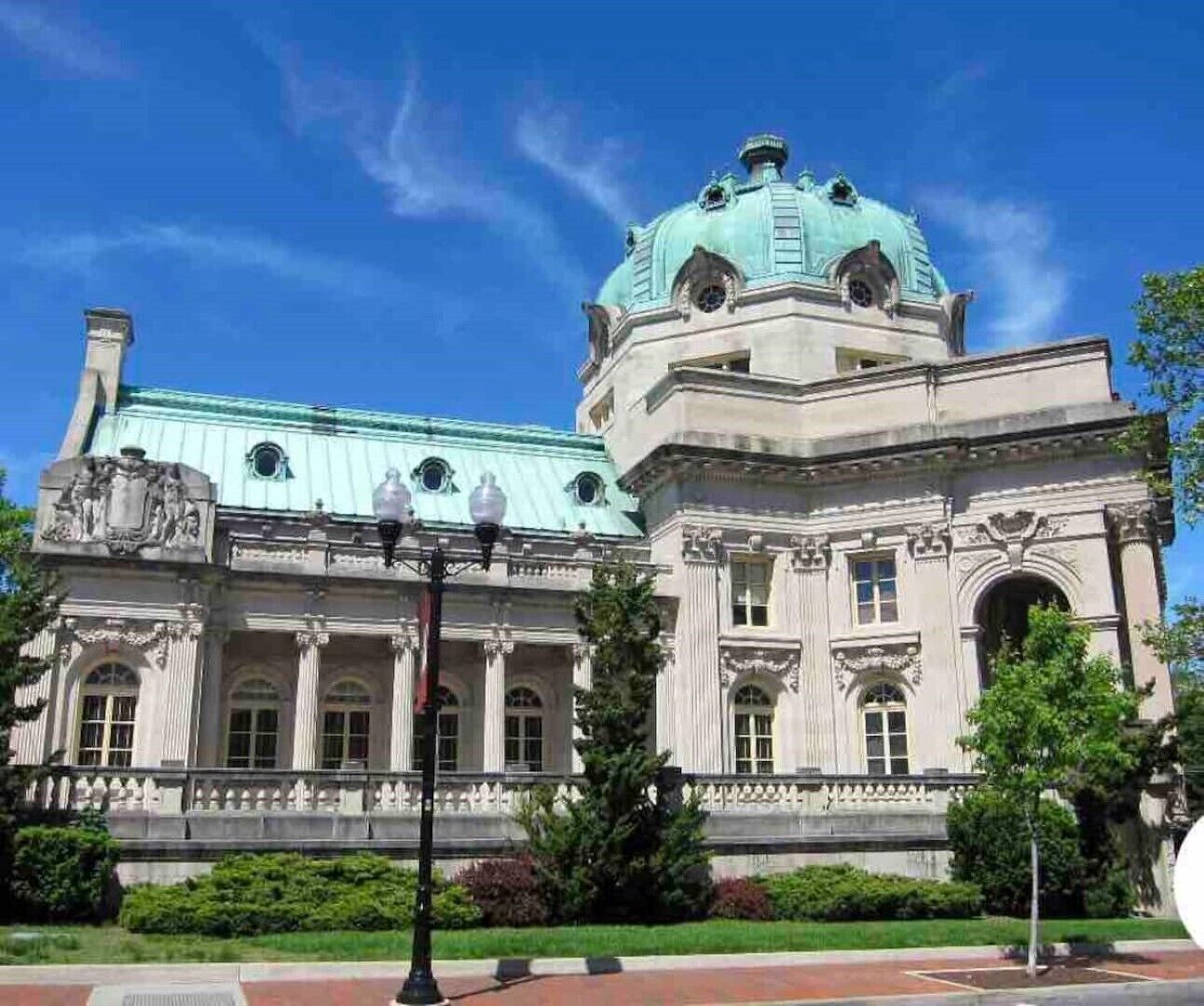 A large, historic building with a prominent dome and classical architecture.