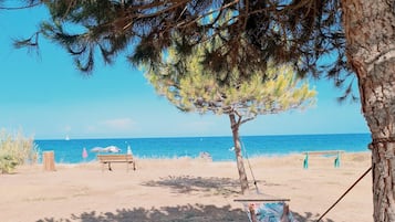 On the beach, sun loungers