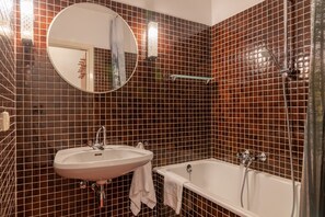 Bathtub, hair dryer, towels