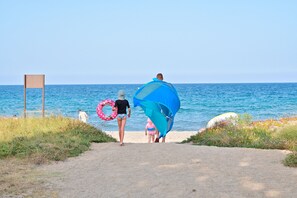 On the beach, sun-loungers
