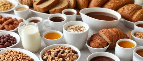 A breakfast spread with various foods and drinks.