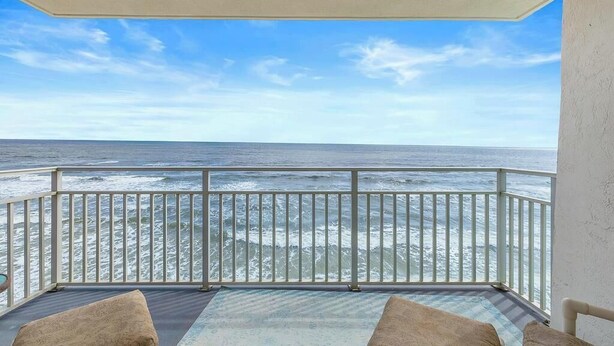 A balcony with a view of the ocean. - Dazzling Oceanfront Views from Corner Condo! Best View in NSB! (New Smyrna Beach)