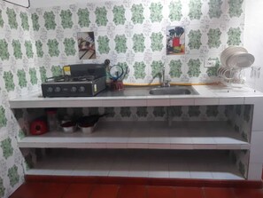 Fridge, blender, coffee grinder, cookware/dishes/utensils