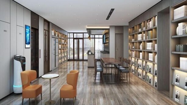 A modern library with bookshelves, a dining area, and a fireplace. - HanTing Hotel (Eye of Tianjin) (Tianjin)