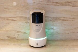 A portable device with a digital display and a power indicator light.