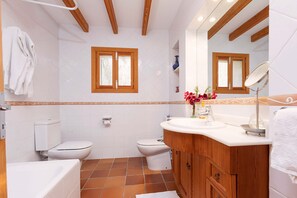 Bathtub, hair dryer, towels