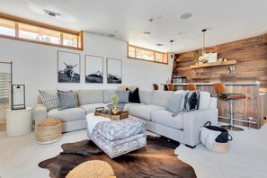 Smart TV, fireplace, table football, books
