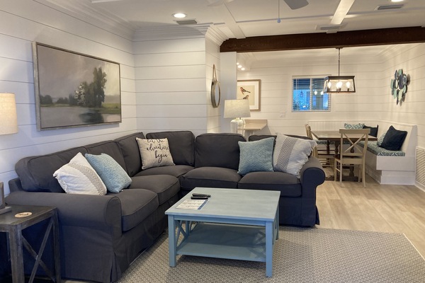 The cool coastal colors of the living room welcome you to your island getaway!