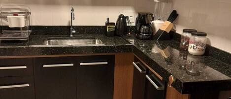 Fridge, microwave, stovetop, coffee/tea maker