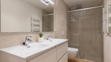 Shower, eco-friendly toiletries, hair dryer, towels