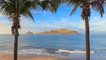 On the beach, beach umbrellas, beach towels, beach bar