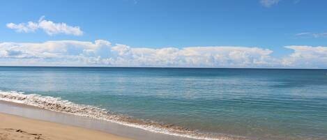 On the beach, sun loungers, beach towels