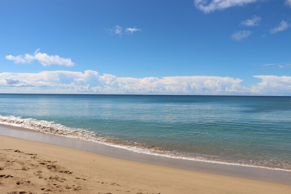 On the beach, sun loungers, beach towels