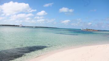 On the beach, sun loungers, beach towels