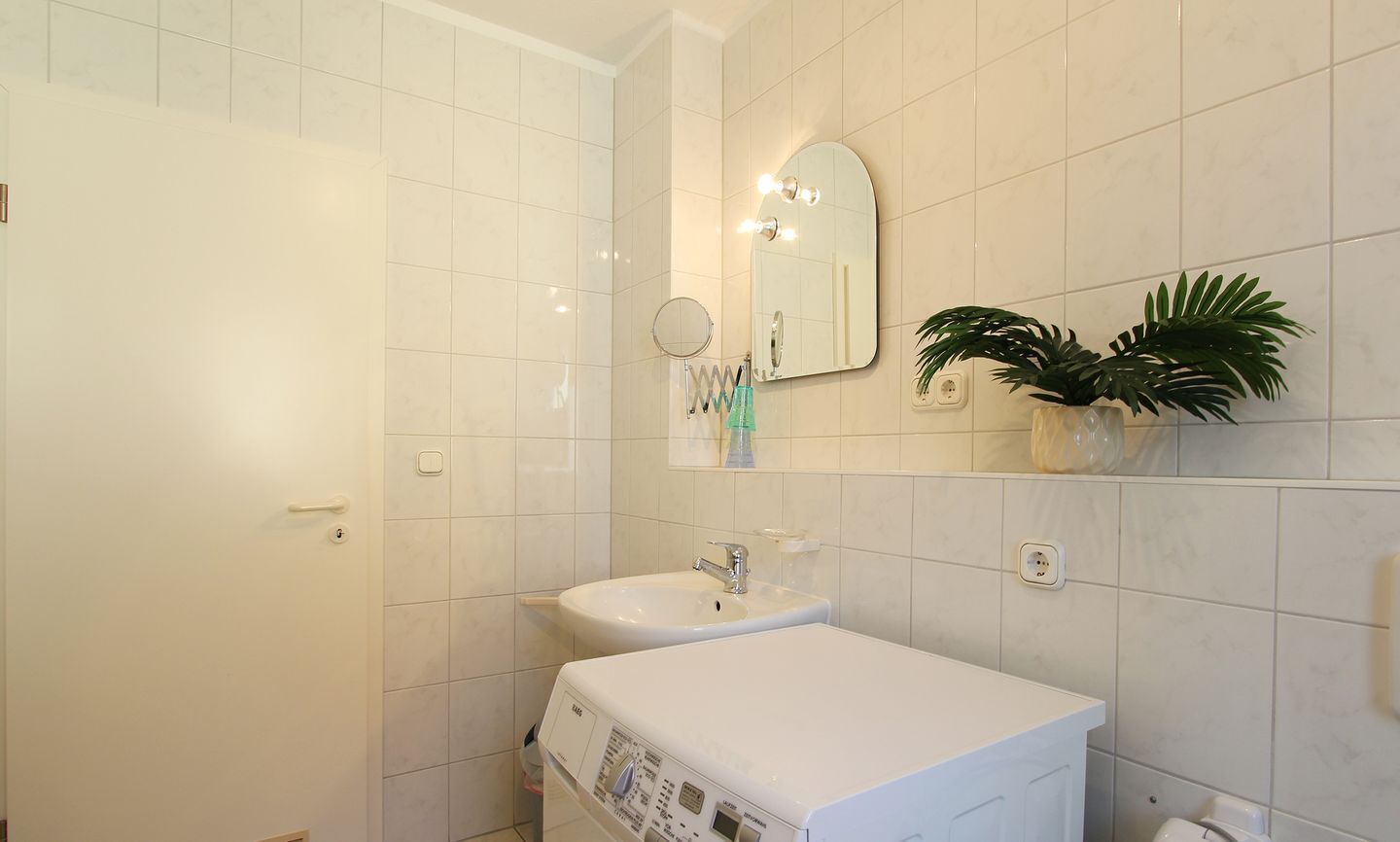 Chuveiro, toalhas de banho