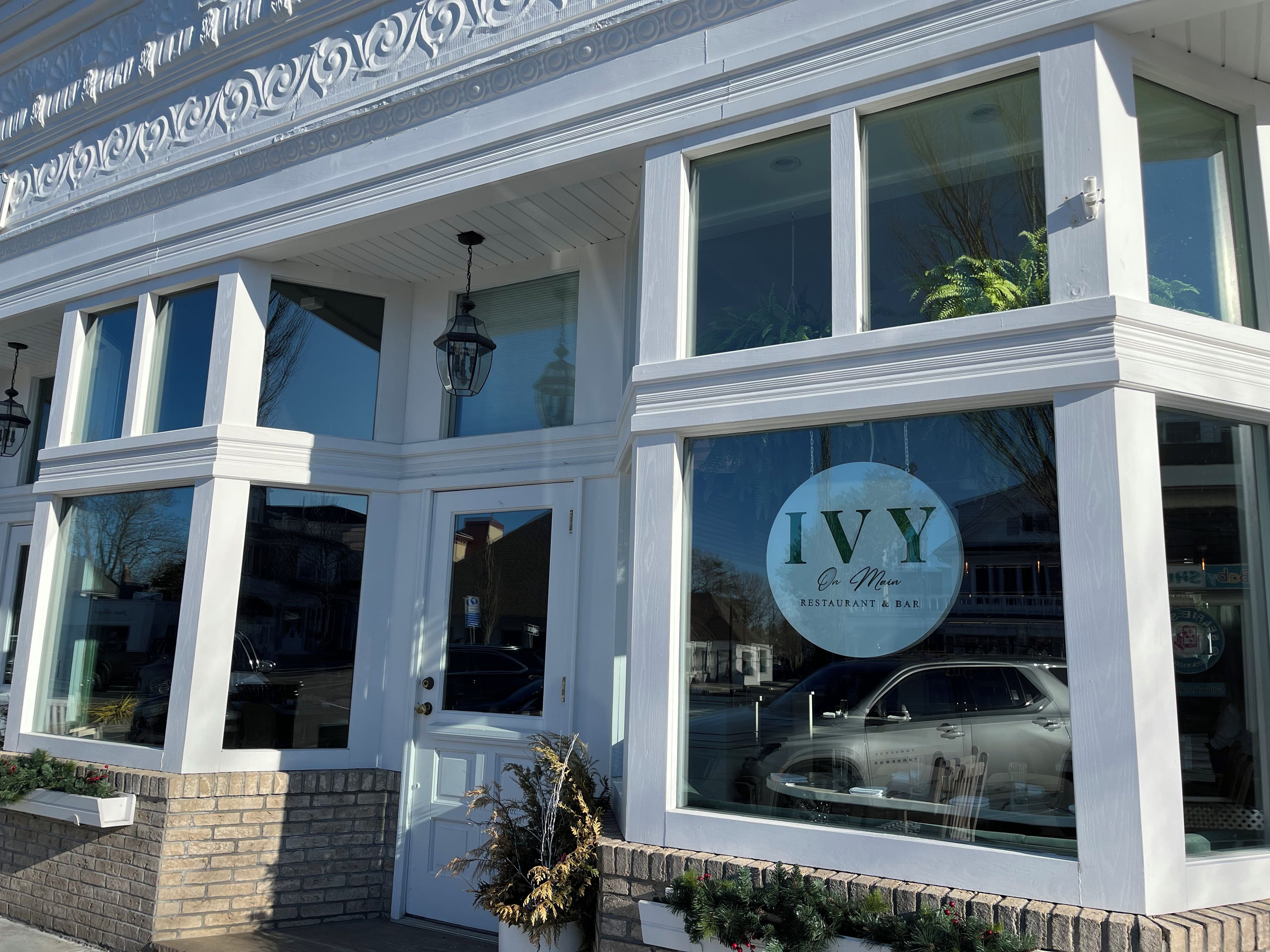 A two-story building with a prominent sign reading 'Ivy On Main' indicating a restaurant and bar.