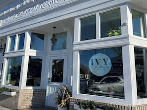 A two-story building with a prominent sign reading 'Ivy On Main' indicating a restaurant and bar.